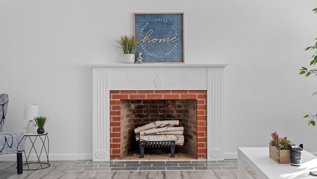 room details with hardwood / wood-style flooring and a fireplace