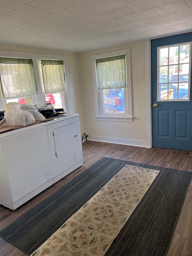 laundry area featuring separate washer and dryer and dark hardwood / wood-style floors