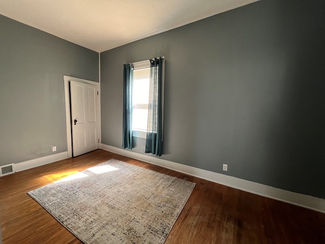 empty room with wood-type flooring