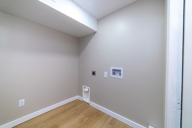 7331 State Route 314, Bellville, OH 44813 - laundry room with electric dryer hookup, light wood finished floors, and hookup for a washing machine