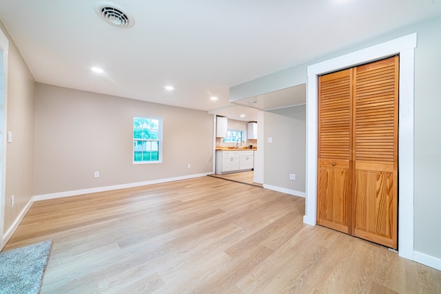 7331 State Route 314, Bellville, OH 44813 - unfurnished bedroom featuring light wood-type flooring, ensuite bath, recessed lighting, and a closet