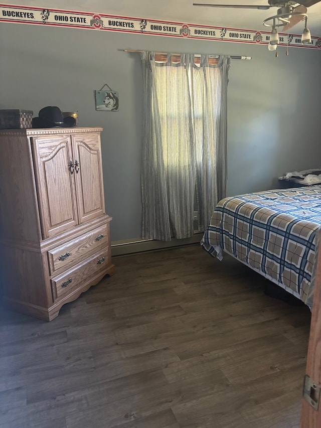 bedroom with dark hardwood / wood-style flooring