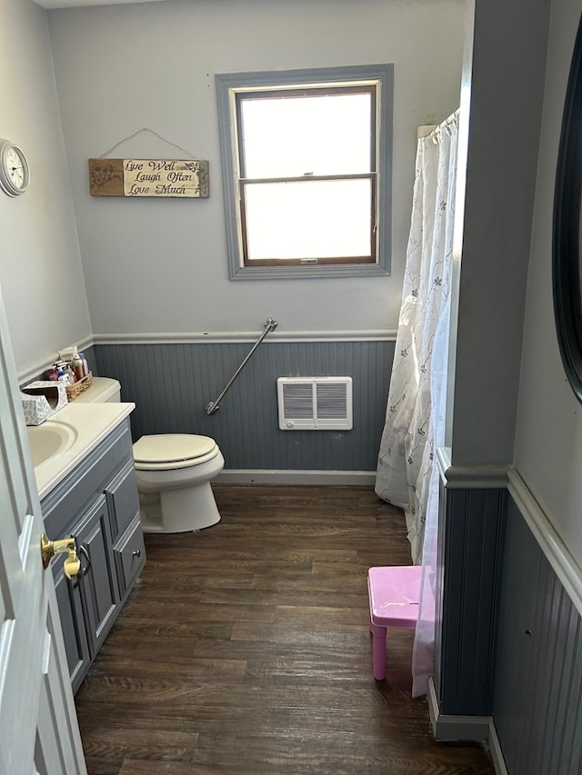 bathroom with hardwood / wood-style floors, vanity, and toilet