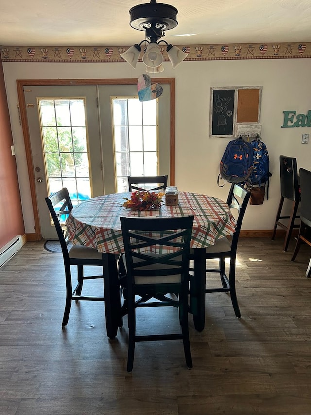 dining space with hardwood / wood-style floors