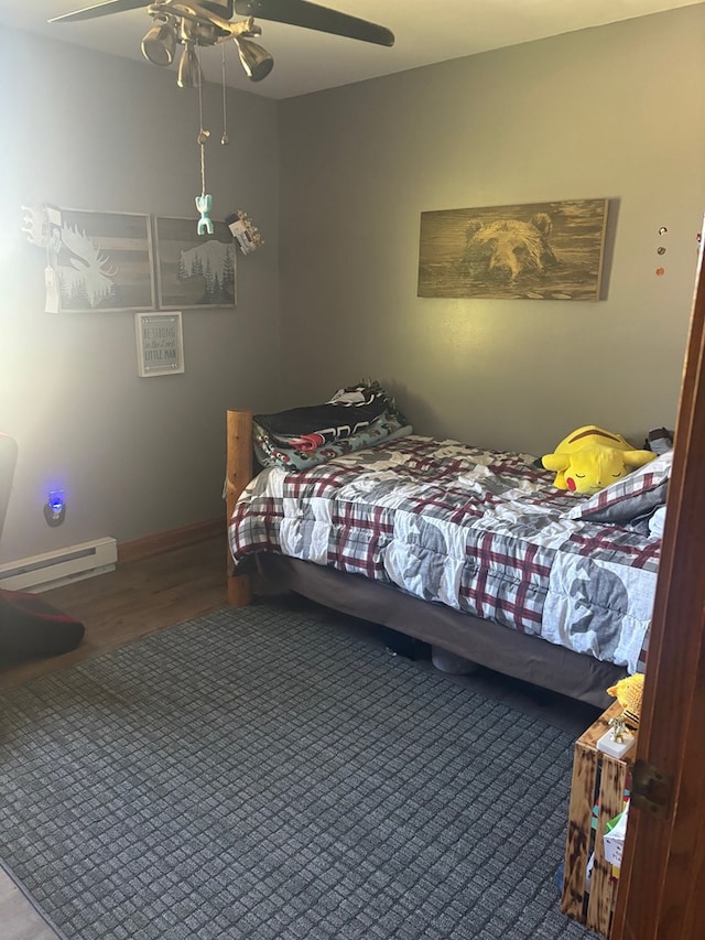 bedroom featuring ceiling fan and baseboard heating