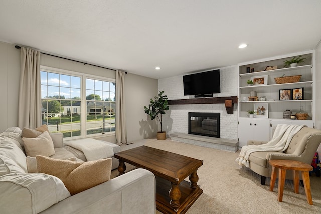 living room with light colored carpet and a brick fireplace