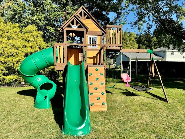 view of jungle gym featuring a lawn