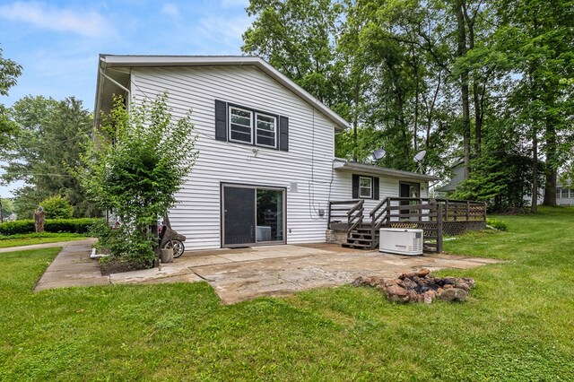 2055 Random Dr, Mansfield, OH 44904 - rear view of property with a patio, a wooden deck, and a yard