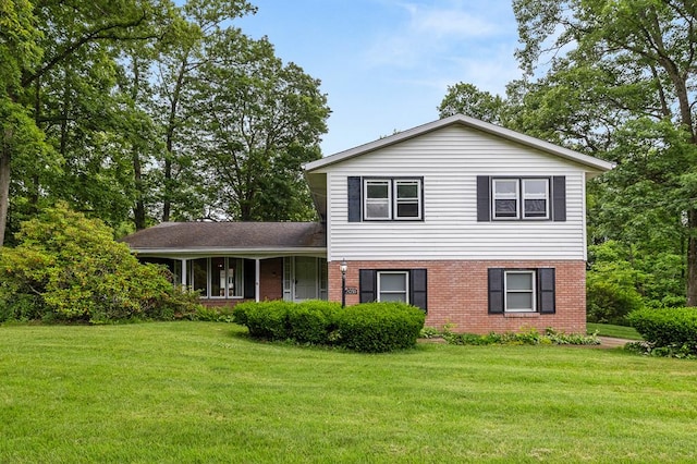 2055 Random Dr, Mansfield, OH 44904 - split level home with brick siding and a front lawn