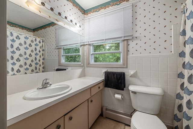 2055 Random Dr, Mansfield, OH 44904 - bathroom featuring wallpapered walls, baseboard heating, vanity, tile walls, and a shower with curtain