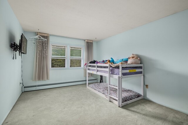 2055 Random Dr, Mansfield, OH 44904 - carpeted bedroom featuring a baseboard radiator