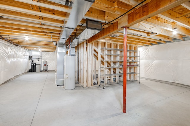 basement featuring heating unit and water heater