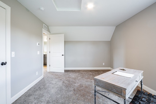 interior space with lofted ceiling and carpet