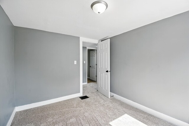 456 Park St, Marion, OH 43302 - spare room featuring carpet flooring and baseboards