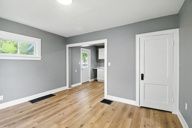 456 Park St, Marion, OH 43302 - unfurnished bedroom with baseboards and light wood-style flooring
