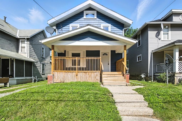 456 Park St, Marion, OH 43302 - shotgun-style home featuring covered porch and a front lawn