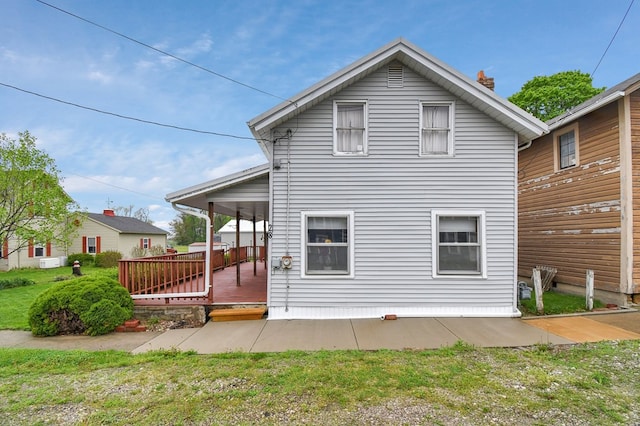 28 W Main St, Hayesville, OH 44838 - back of house with a chimney and a deck