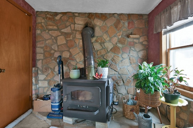 28 W Main St, Hayesville, OH 44838 - interior details with a wood stove and a textured ceiling