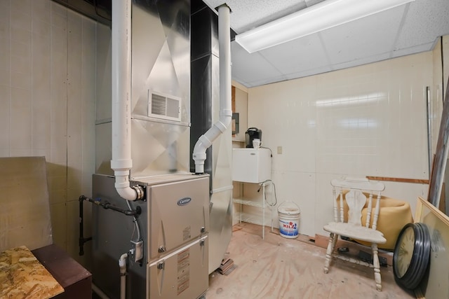 38 E Main St, Shelby, OH 44875 - utility room featuring heating unit