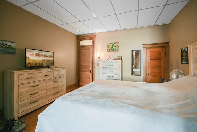 38 E Main St, Shelby, OH 44875 - bedroom with dark wood-style flooring and a paneled ceiling