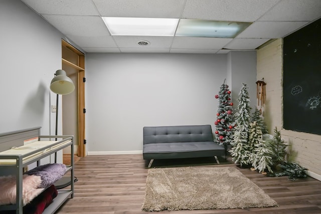 38 E Main St, Shelby, OH 44875 - living area with wood finished floors and a drop ceiling