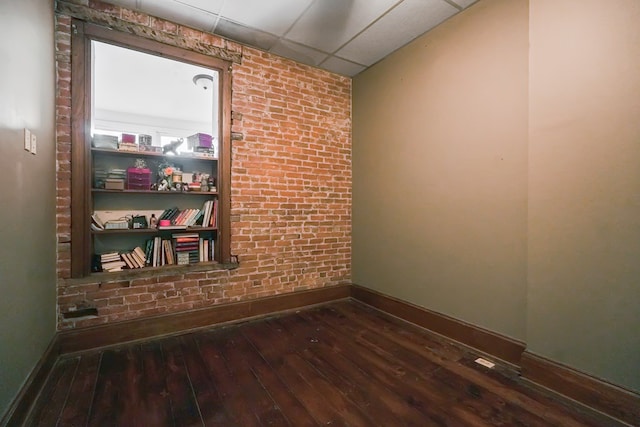 38 E Main St, Shelby, OH 44875 - spare room with a paneled ceiling and wood-type flooring