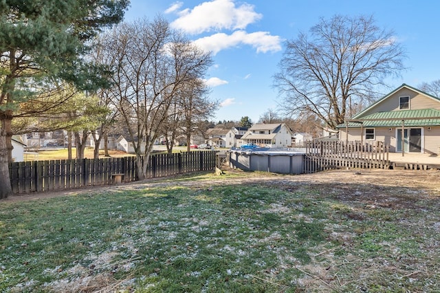 view of yard with a pool side deck