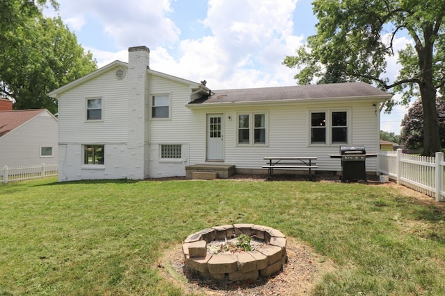 468 Clearview Rd, Mansfield, OH 44907 - back of house with a chimney, a fenced backyard, and a fire pit