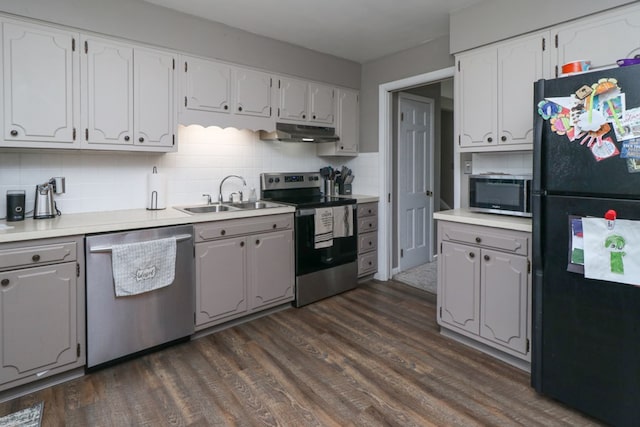 468 Clearview Rd, Mansfield, OH 44907 - kitchen featuring stainless steel appliances, under cabinet range hood, dark wood-style floors, tasteful backsplash, and light countertops
