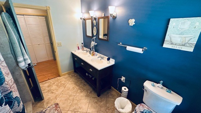 920 Woodbine St, Willard, OH 44890 - bathroom with double vanity and tile patterned floors