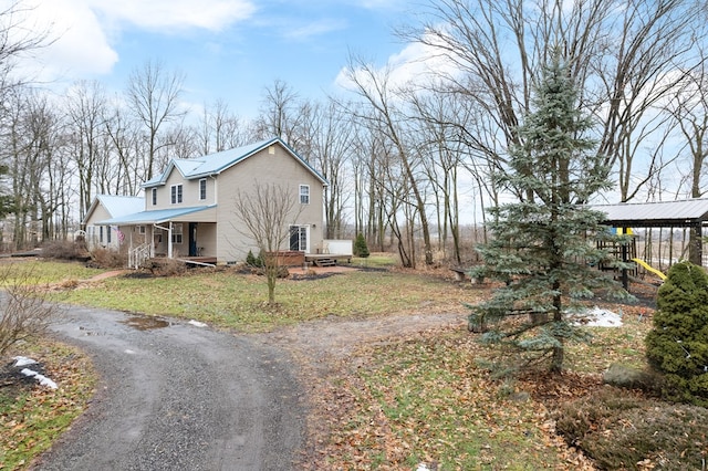 view of property exterior with covered porch