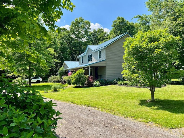 view of home's exterior featuring a lawn