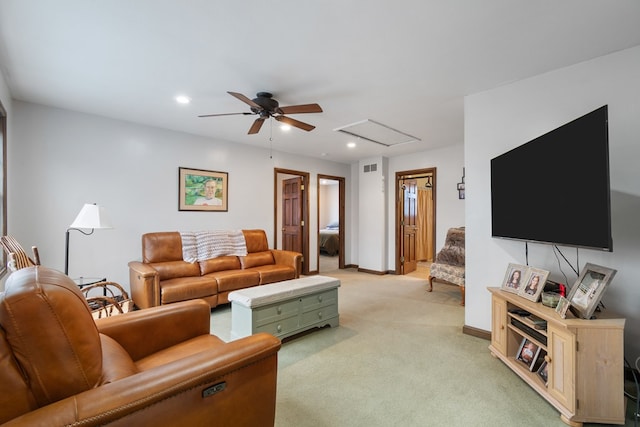 carpeted living room featuring ceiling fan