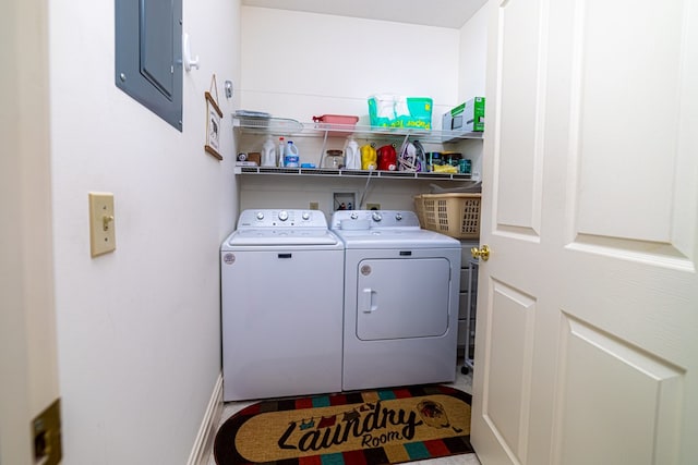 clothes washing area featuring separate washer and dryer and electric panel