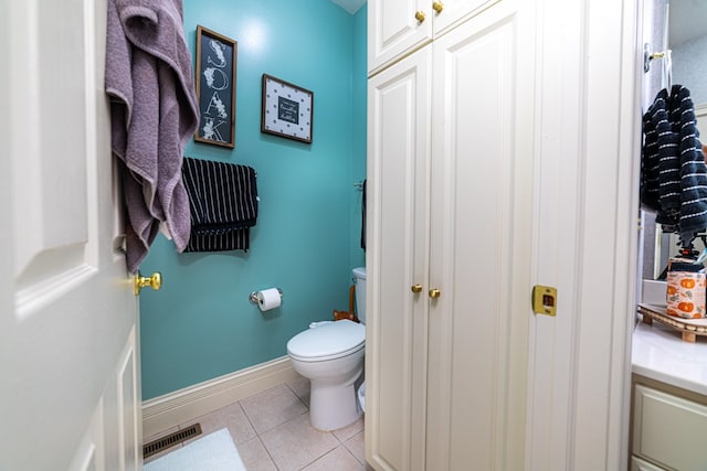 bathroom with tile patterned floors and toilet