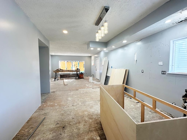 hallway featuring a textured ceiling