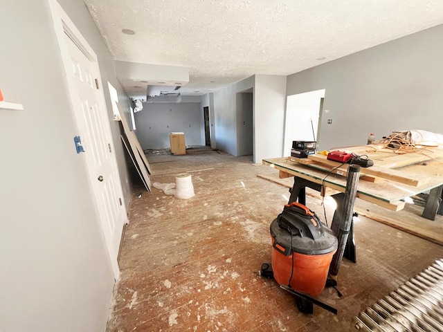 interior space with a textured ceiling