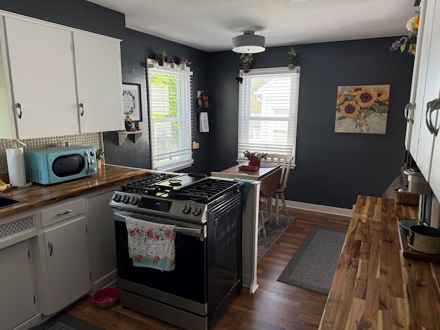 538 Broadview Ave, Mansfield, OH 44903 - kitchen with stainless steel gas stove, wood counters, dark wood-style floors, and white cabinets