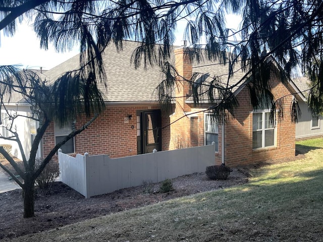 view of side of property featuring a yard