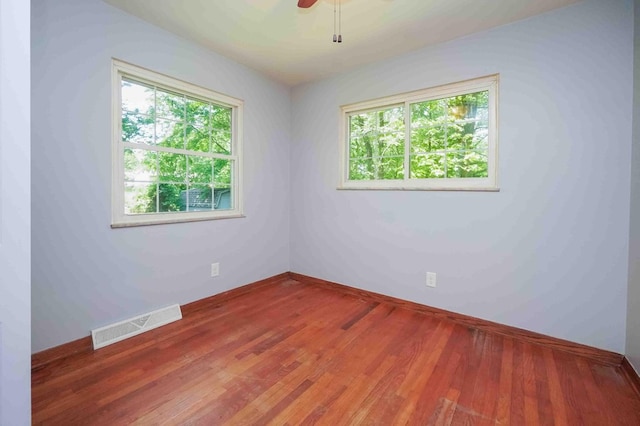 18373 Bentwood Dr, Doylestown, OH 44230 - empty room featuring healthy amount of natural light, wood finished floors, and ceiling fan