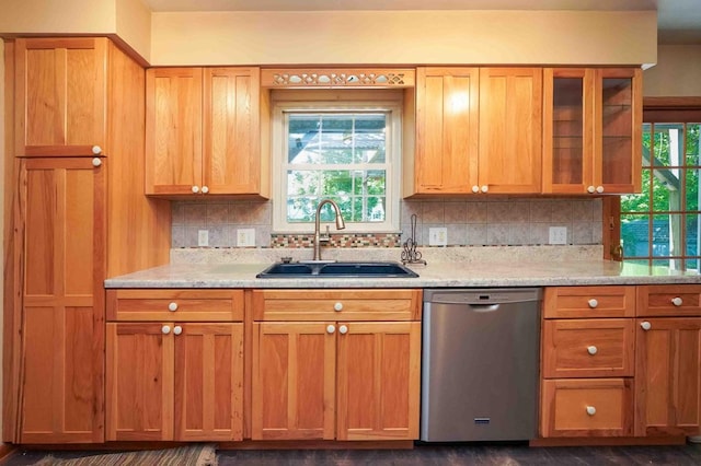 18373 Bentwood Dr, Doylestown, OH 44230 - kitchen with stainless steel dishwasher, backsplash, glass insert cabinets, and light stone countertops