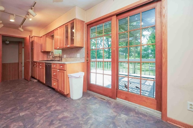18373 Bentwood Dr, Doylestown, OH 44230 - kitchen with dishwasher, light countertops, glass insert cabinets, and backsplash