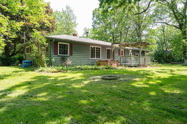 18373 Bentwood Dr, Doylestown, OH 44230 - view of front of house with a hot tub, a front lawn, and a deck
