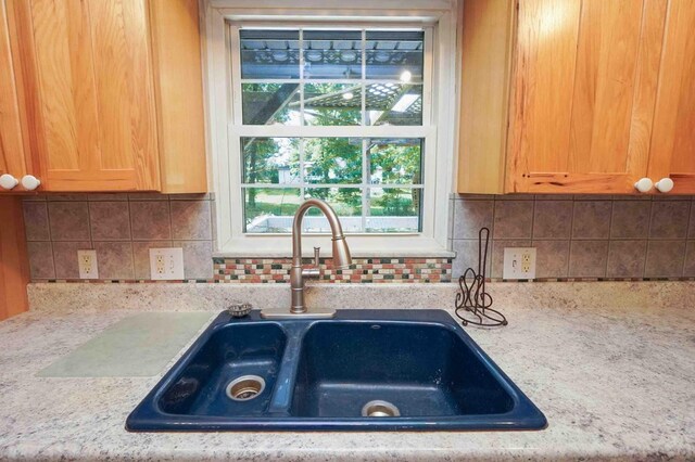 18373 Bentwood Dr, Doylestown, OH 44230 - kitchen with healthy amount of natural light and backsplash