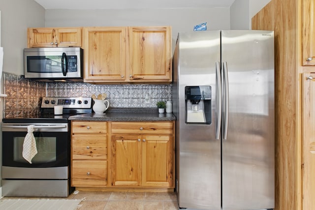 16.5 Monroe Ave, Shelby, OH 44875 - kitchen with appliances with stainless steel finishes, dark countertops, backsplash, and light brown cabinetry