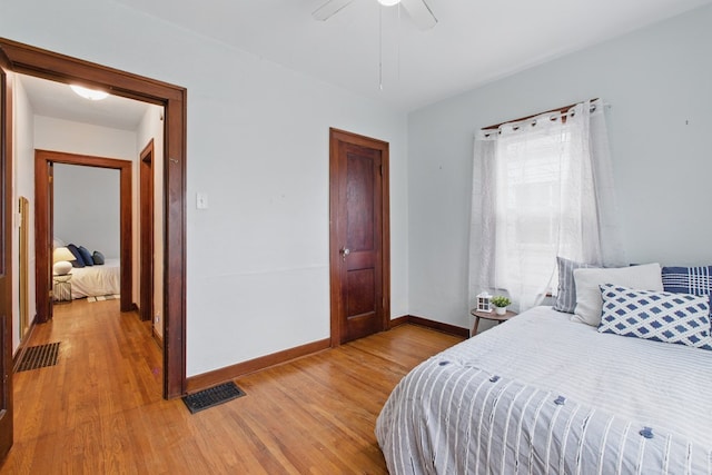16.5 Monroe Ave, Shelby, OH 44875 - bedroom with light wood-type flooring, baseboards, and ceiling fan