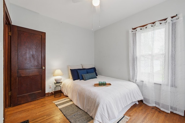 16.5 Monroe Ave, Shelby, OH 44875 - bedroom with light wood-type flooring, baseboards, and ceiling fan