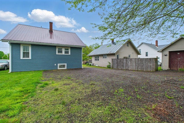 16.5 Monroe Ave, Shelby, OH 44875 - rear view of property featuring metal roof and a chimney