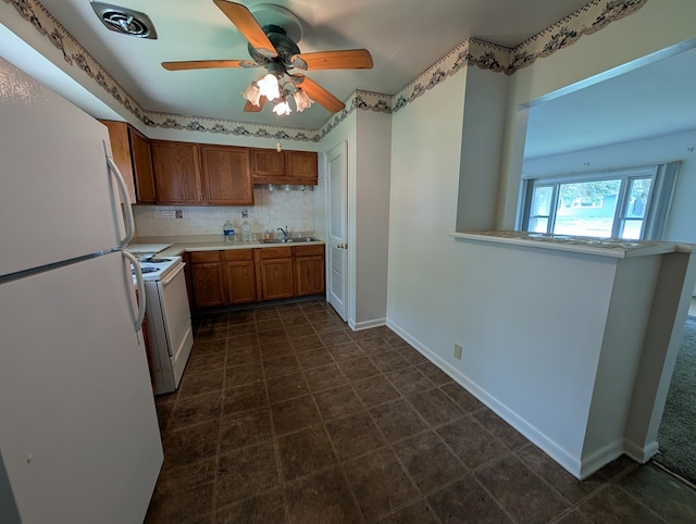 272 Hillside St, Mount Gilead, OH 43338 - kitchen featuring white appliances, brown cabinetry, light countertops, backsplash, and ceiling fan