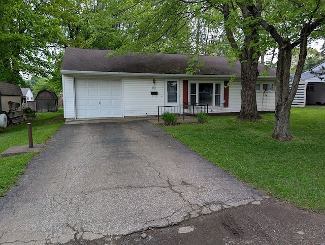 272 Hillside St, Mount Gilead, OH 43338 - ranch-style house with driveway, a front yard, covered porch, and a garage